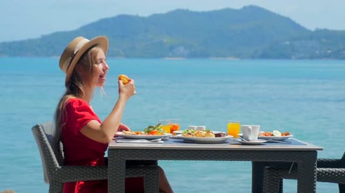 Woman Relaxing in a Luxury Hotel with a Sea View