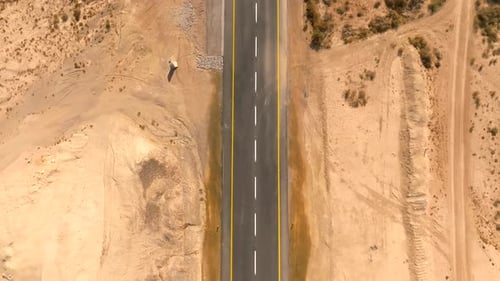 Empty Desert highway, Top down aerial camera movement fifty meters above ground level