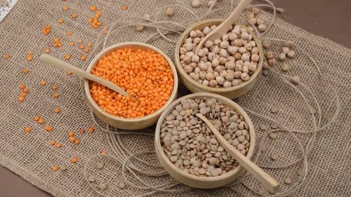 Vibrant Legumes Displayed in Rustic Wooden Bowls