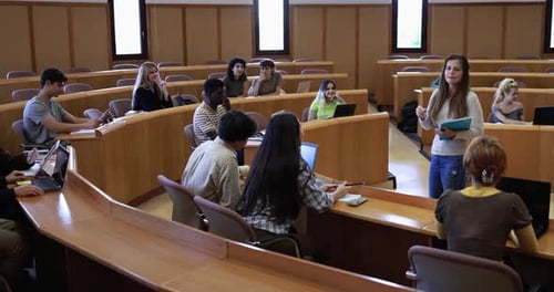 Teacher Working with Students Inside Classroom at School University Academic
