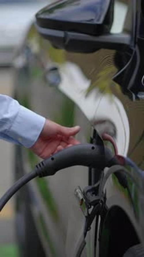 A CloseUp View of an Electric Vehicle Charging Station Harnessing Sustainable Energy
