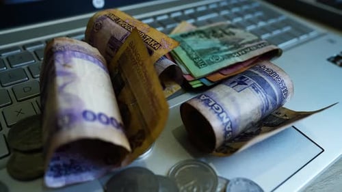 Money and Coins on Laptop Keyboard, Business Finance