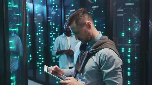 Men Working on Servers in Modern Data Center