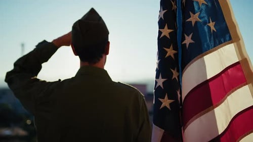 Soldier in Uniform Saluting American Flag