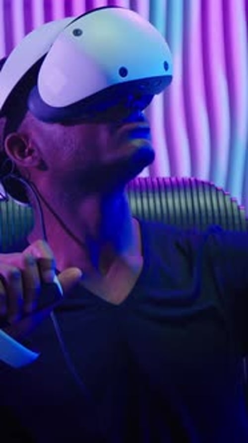 Man Wearing VR Headset with Neon Lighting