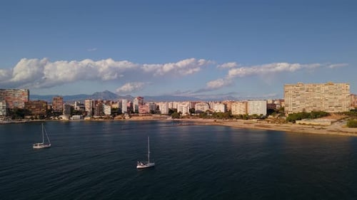 Aerial View of Alicante Beachfront with Apartment Buildings Sandy Coast and Sailing Boats on the