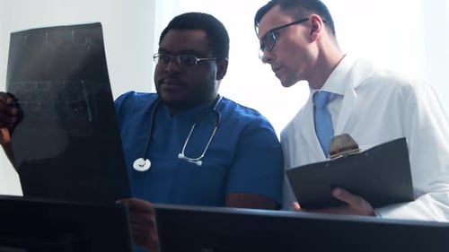 Doctor and Surgeon Talking Near Window Medical Workers in Hospital Office Day Light Healthcare