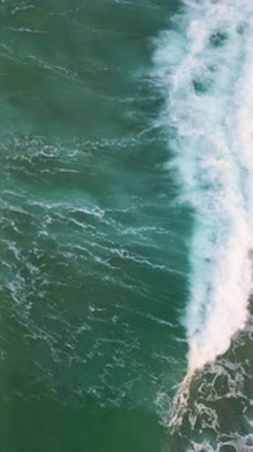 Vertical White Ocean Foam Splashing Waving Super Slow Motion Stormy Sea Water