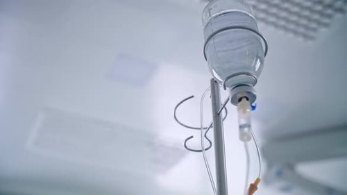 Intravenous Drip Hanging in a Hospital Room