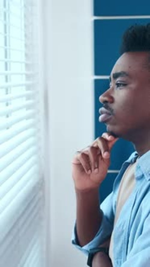 Contemplating Life Changes While Gazing Out the Window in a Calm Setting