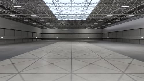 Large empty warehouse with high steel truss ceiling