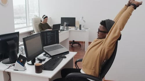 Young Black Man At Work In Modern Office