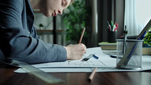 Person Working on Architectural Designs