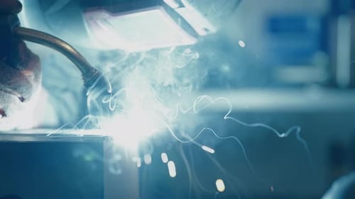 Industrial Welding Sparks Flying in Workshop