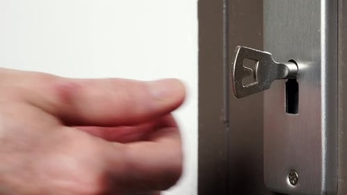 Skeleton Key Going Into Old Keyhole Lock