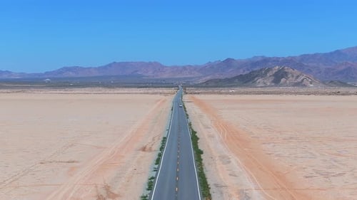 Endless Road to Horizon Through the Desert Valley Aerial View of a Desert