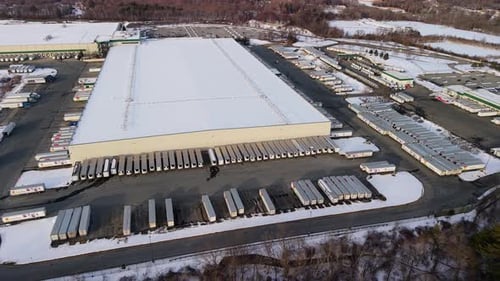 Aerial view of snow covered warehouse, United States.