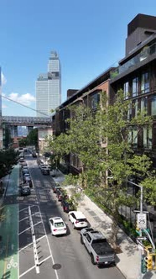 A vertical panning shot of Williamsburg, Brooklyn, captured by drone in daytime with clear weather,