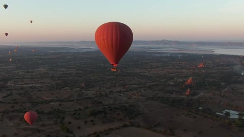 Drone dolley shot of hot air Balloons over the temples of Bagan in Myanmar.