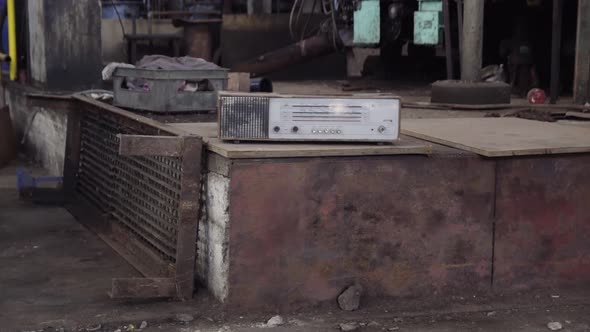 old radio in closed factory with mess messy industrial ambience post ...