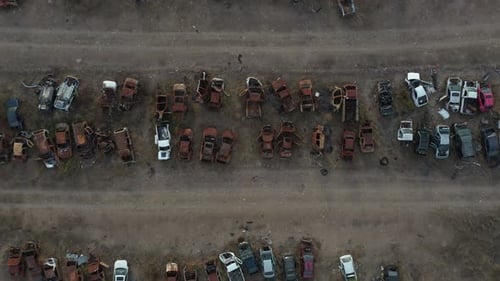Bottom up aerial cenital shot from a abandonated car junk