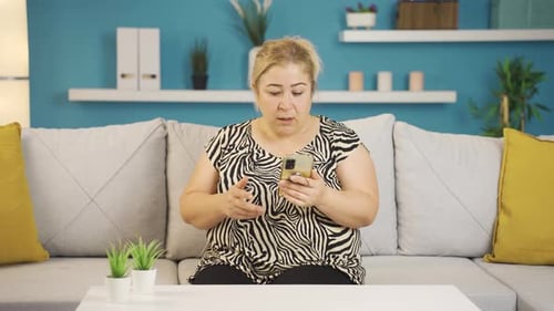 Woman Receives Bad News on Cell Phone and Cries