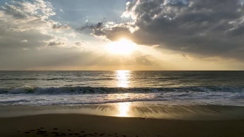 Aerial View A Magical Sunset with Golden Clouds Glowing Above the Mediterranean Reflecting on the