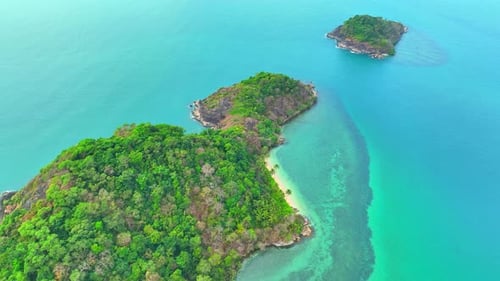 Captivating aerial shot: Pristine tropical sea below. 4K.