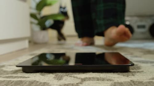 Bare Feet Step on a Digital Scale