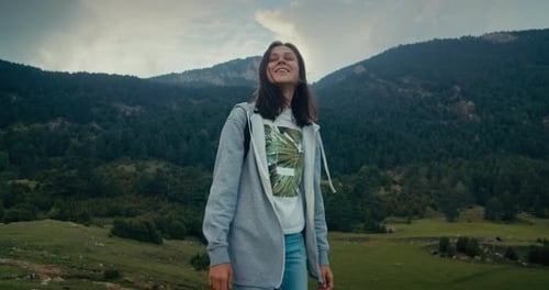 Cheerful Young Adult Woman Walk with Backpack on Mountain Travel on Tourist Path