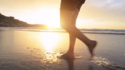 4k video footage of a woman taking a stroll on the beach