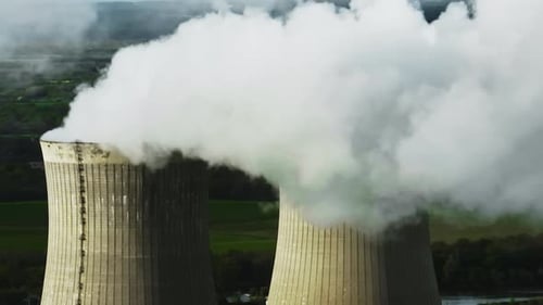 Aerial View Nuclear Power Plant Steam Rises From the Huge Chimneys of the Operating Power Plant