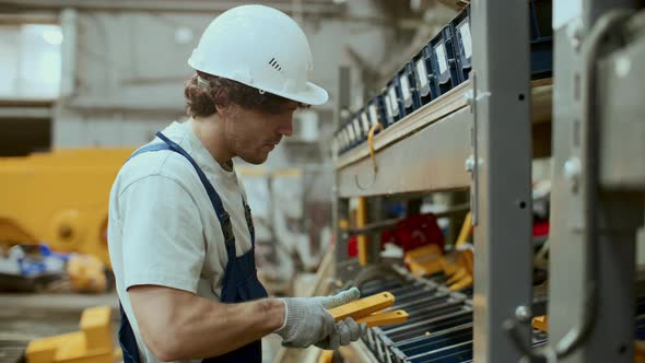 Male Worker Arranging Components on Shelf in Industrial Factory ...