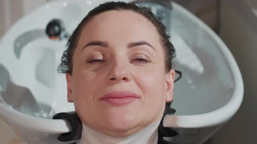 Calm Scene with Woman Getting Soft Hair Wash and Massage Tranquil Moment As Woman is Pampered with