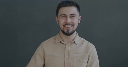 Smiling Man Gives Thumbs Up Gesture