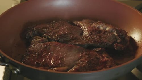 Steak Sizzling in Frying Pan, Cooking Meat