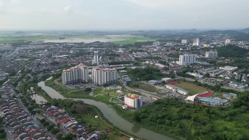 An aerial view of a residential estate with a river running through it