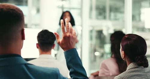 Raised hand, person and question in audience, business people and training at workshop for career