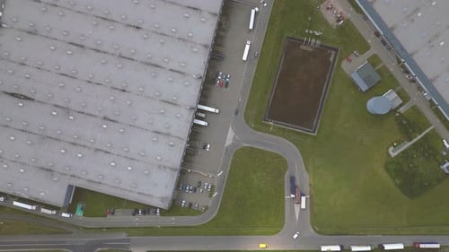 Aerial view of goods warehouse. Logistics center in industrial city zone from above. Aerial view of