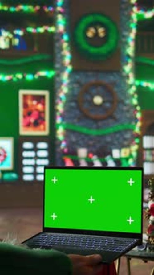 Vertical Video Man Uses Mockup Notebook Preparing to Send Presents to Children