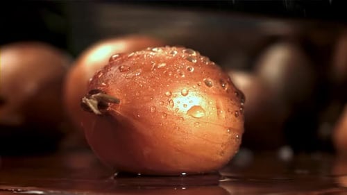 Onion Sliced in Half in Slow Motion