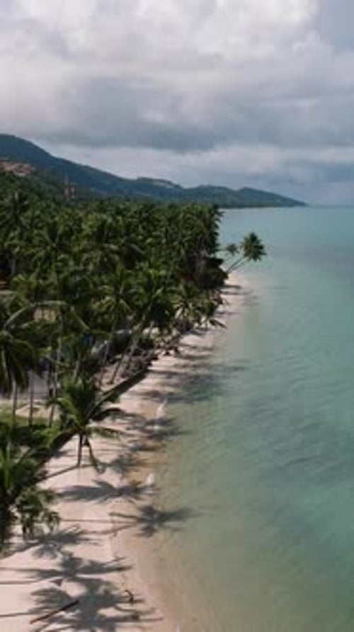 Seaside View with Turquoise Water and Redroofed Houses Ko Samui Thailand