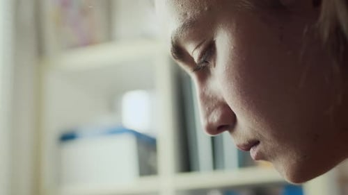 Woman Coloring Comic Book Panels at Her Desk