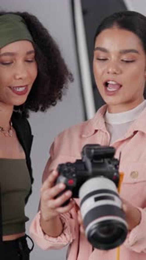 Two Friends Reviewing Digital Camera