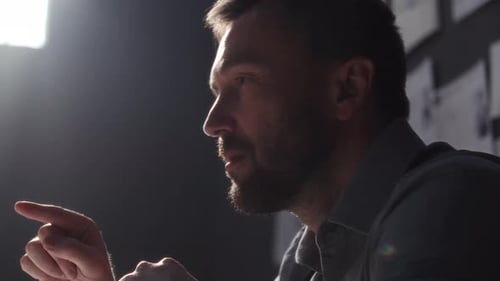 Man Talking in Dramatic Lighting in Office