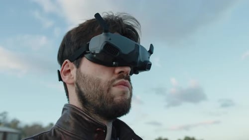 Man in Virtual Reality Glasses Pilot His Technology Drone