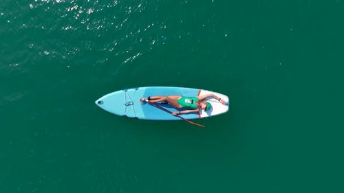 Aerial View Paddleboarding Adventure in the Green Canyon Swimming and Summer Relaxation