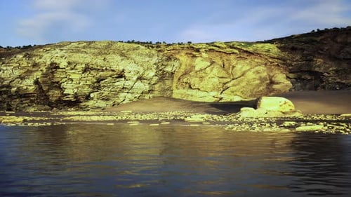 Serene Beach Scene Featuring Cliffs and Tranquil Water Background
