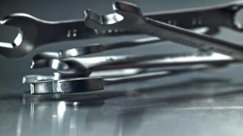 Stacked Wrenches and Spanners with Reflective Highlights Filmed on a Highspeed Camera at 1000 Fps