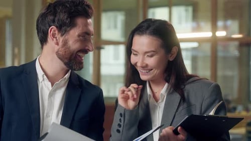 Multiethnic Cheerful Business Colleagues Laughing Reviewing Documents Korean Woman Professional